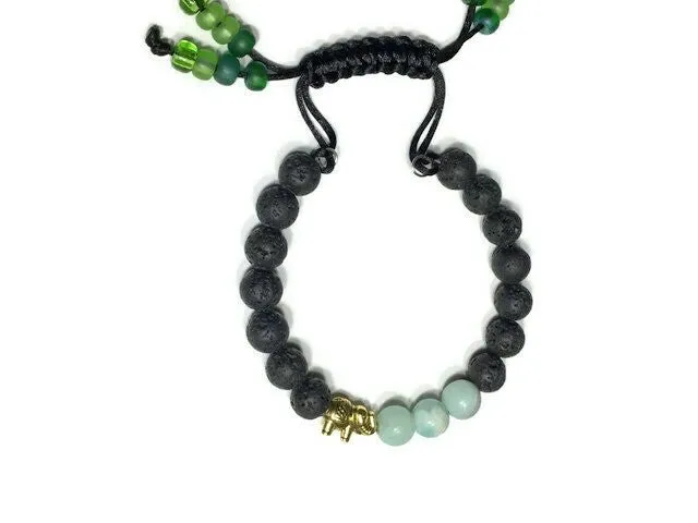 THE GOLDEN ELEPHANT DIFFUSER BRACELET, black lava rocks with green amazonite stones, macramê clasp, memory wire, woman's size, essential oil diffuser,